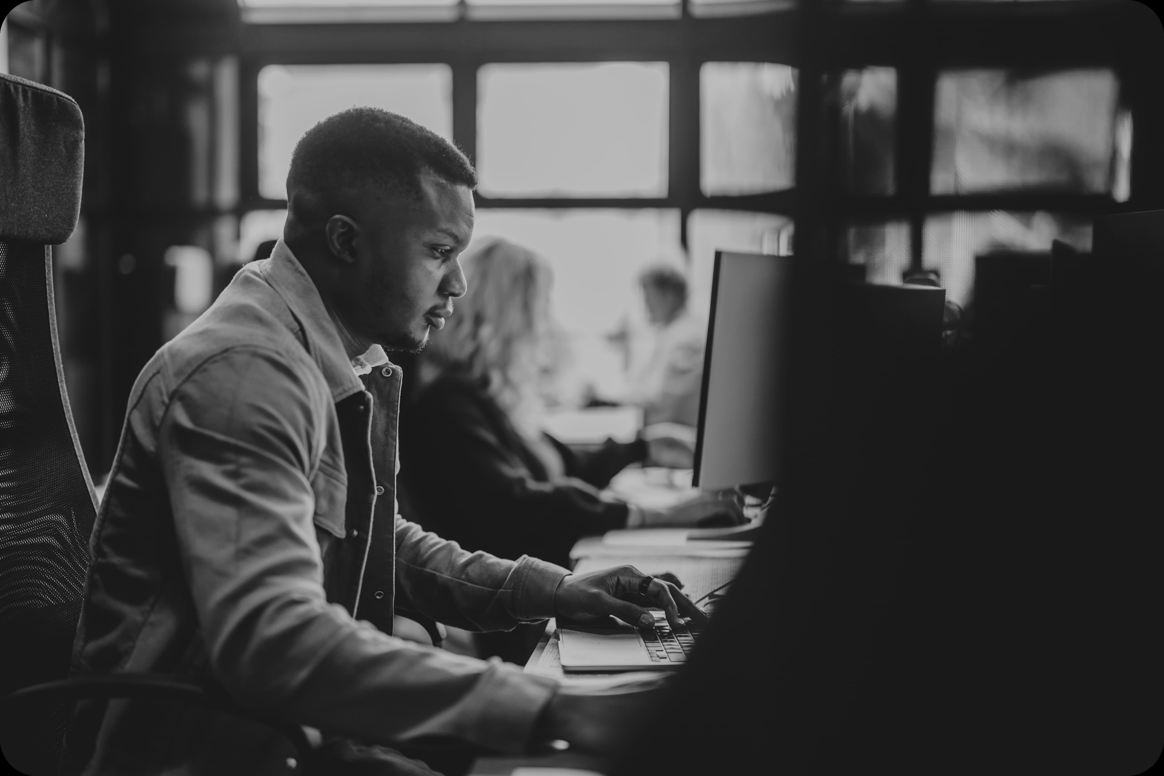 A member of the Mira team at work at a desk